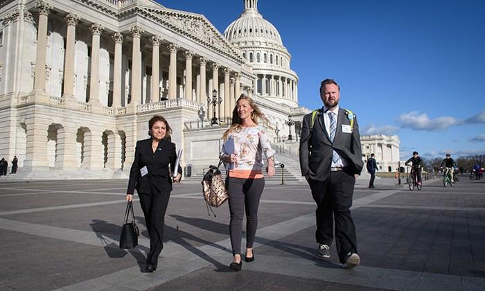 (Left to right) CF Foundation Senior Manager of Policy and Advocacy Azi Kaider and volunteer advocates Rachel and Jeremy Olimb walk to meet with a member of Congress during the 2017 March on the Hill.