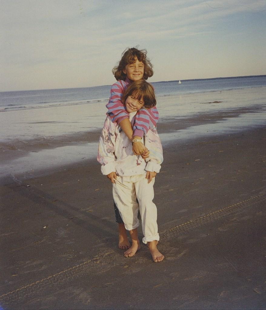 Breathing in the salty air with my big sister Erin, circa 1988.