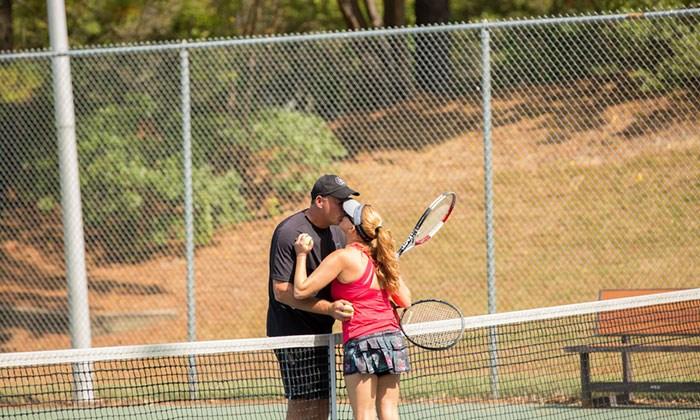 Couple kissing after a tennis match