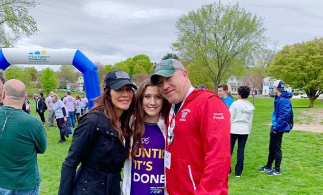 Julia Purcell at a Great Strides walk with her mom and dad.