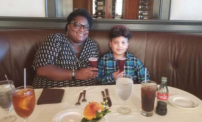 Lathronia and her son at a restaurant. 