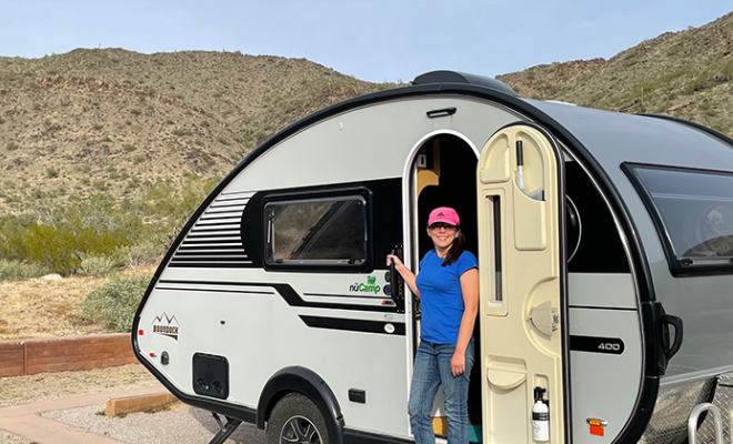 Meagan standing outside of an RV.