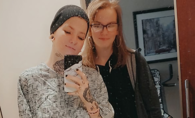 Lin Marando taking a selfie in a hospital mirror with a friend