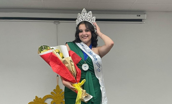 Allissa smiling and posing in her pageant crown and sash, holding a bouquet of flowers
