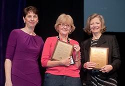 Cynthia George presents the Mary M. Kontos Care Champion Award to Lynn Feenan and Connie Richless.