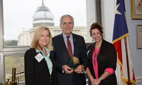 Rep. Doggett accepts award from volunteers during March on the HIll.