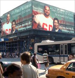 Fourteen-year-old Sean Squires, who has CF, and NFL Pro Bowl center Shaun O'Hara are the stars of a 6,000-square-foot Port Authority billboard that raises awareness of cystic fibrosis.
