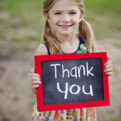Little Girl With Thank You Sign